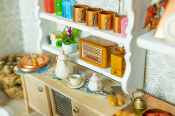 retro-style miniature dollhouse scale kitchen roombox with handcrafted furniture, dishes and utensils, miniature enthusiasts