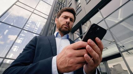 Mobile phone connection problem lost Wi-Fi broken smartphone entrepreneur near office angry upset with cellphone trouble online connect Caucasian man businessman guy male business in city bad signal