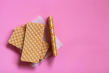 Waffles on a smooth pink background. perfect for illustrating a minimalist breakfast or dessert...