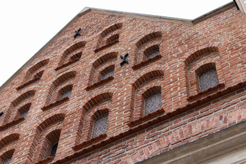 Medieval Brick Facade with Arched Windows