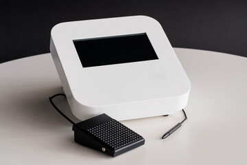 Modern White Digital Machine with Touchscreen Display, Black Foot Pedal, and Stylus Pen on Round...