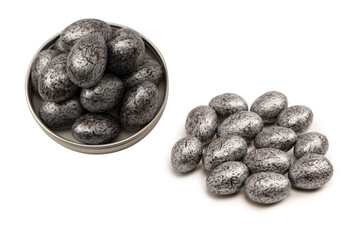 Chocolate silver eggs isolated on a white background.