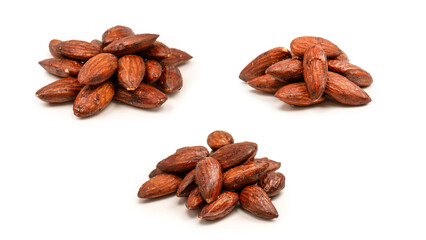 A group of caramelized almonds isolated on a white background.
