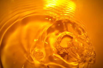 The surface of the water splashes orange.