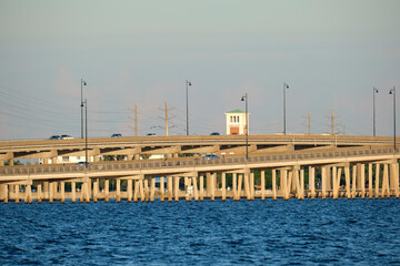 Barron Collier Bridge and Gilchrist Bridge in Florida with moving traffic. Transportation...