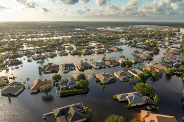 Flooded houses from hurricane rainfall water in Florida residential community. Aftermath of natural disaster in USA south