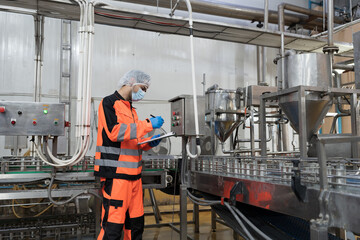 Canned fish factory, seafood manufacturing and food processing. Conveyor belt and production...