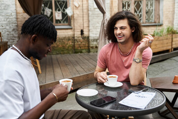 Enjoying a cozy afternoon date in a charming cafe with laughter and love