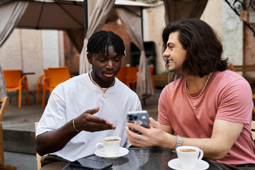 Two handsome men enjoying a romantic date at a cozy cafe while sharing laughs and smiles