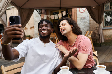 Joyful moments captured during a delightful cafe date between a handsome gay couple in love