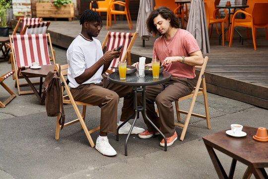 Cherishing moments together at a cozy cafe during a sunny afternoon