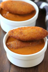 Crispy Fried Fish Patties in Spicy Orange Sauce