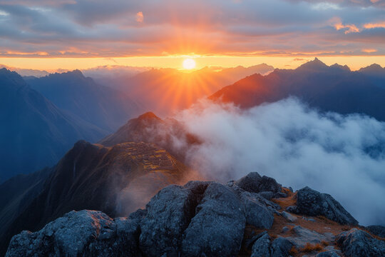 Sun setting over Mount Aspiring summit, with majestic clouds and mountains.