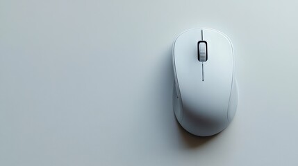 A wireless mouse placed on a white surface, with a clean and minimalist design