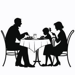 Family having their dinner at the table silhouette