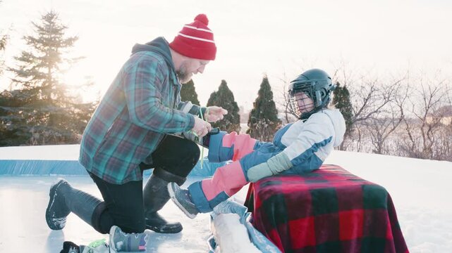 daddy daughter day playing hockey outside