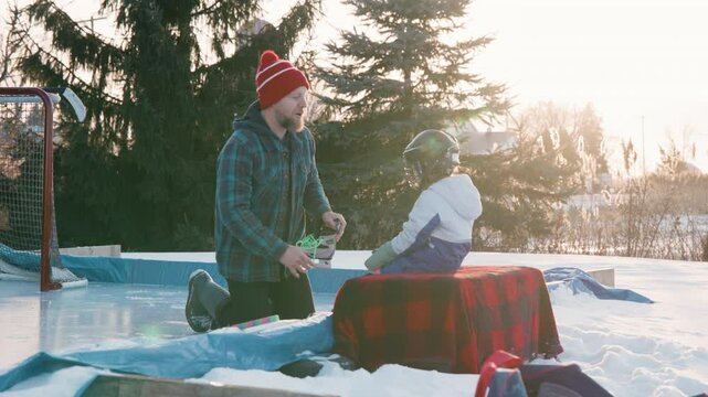 Parenting in canada putting skates on in the cold