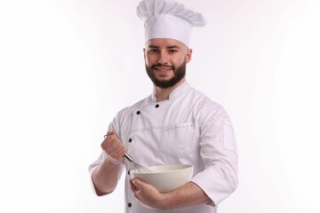 Happy confectioner in uniform holding whisk and bowl on white background