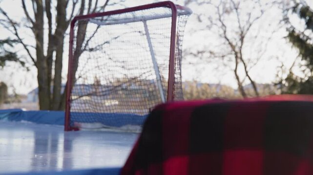 Hockey scene on outdoor rink on a cold day