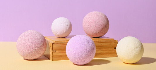 Composition with lavender bath bombs on color background