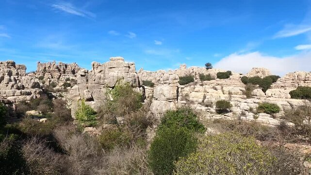 Hiking in the Torcal de Antequerra National Park, limestone rock formations and known for unusual karst landforms in Andalusia, Malaga, Spain.