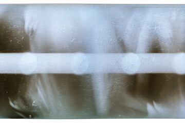 Grungy color 120mm negative film isolated on white background. Medium format film material on white...