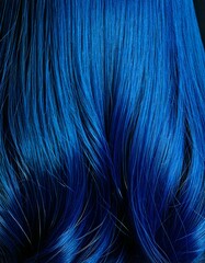 Close-up of curly hair ,showcasing its rich texture, volume, and natural shine.