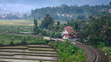 The train passes through the countryside with beautiful natural views