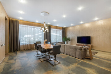 Exclusive interior design of the living room in a luxurious country house. Stylish furniture.