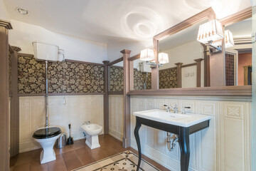 Bathroom with an English-style interior. Stylish decor elements and accessories.