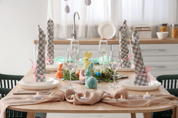 Beautiful table setting for Easter celebration in kitchen