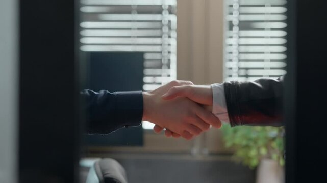 Firm handshake behind closed office doors, secrecy and tension. Legitimate business or corporate fraud of political deal. Hidden observer watches with deception feel. Closing a backroom business deal