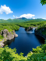 Lake view with waterfall, lush forest, mountains, sunny day