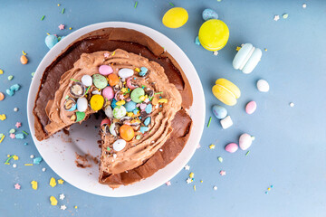 Easter Egg Nest Chocolate Cake. Sweet Easter cake with crushed chocolate eggs, traditional holiday...