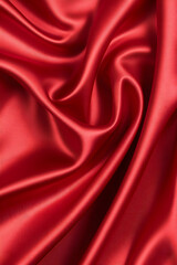 Obraz premium Luxurious red satin fabric with elegant draping and folds