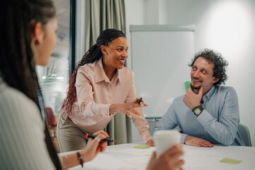 Diverse team collaborating in modern office meeting