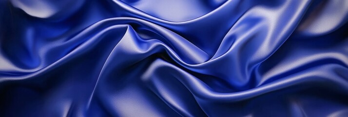 Obraz premium Elegant flowing royal blue silk fabric abstract background texture
