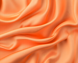 Fototapeta premium Orange fabric with smooth, elegant folds Texture & flow capture luxury