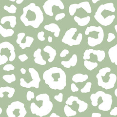 Seamless leopard fur pattern. Fashionable wild leopard print background. Modern panther animal fabric textile print design. Stylish vector green and white illustration