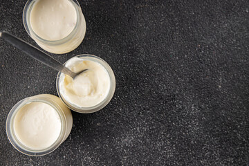 Skyr white yogurt appetizer dish fresh delicious gourmet food background on table rustic food top view copy space keto and paleo diet vegetarian food