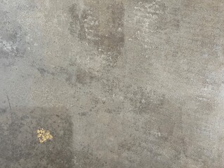 concrete wall or floor in light brown and grey with golden flake and texture as backdrop and wallpaper