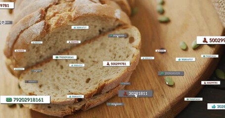 Digital data tags overlaying animation on sliced bread on wooden board - Powered by Adobe