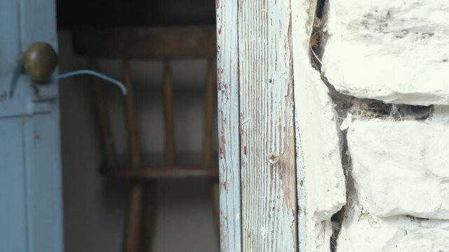 Opening door of old Irish stone cottage
