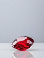 Red gemstone on a light background