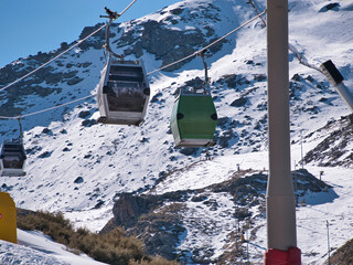 Gondolas that go to the top of the ski resort so that skiers and snowboarders can start the descent...