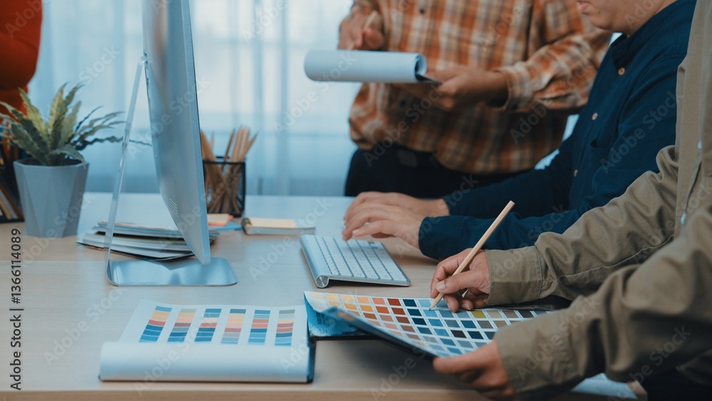Poster a diverse team works together in a modern office environment, selecting color palettes and designs w