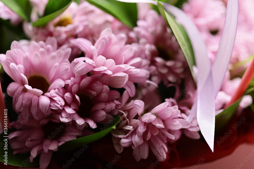 Poster a close up of colorful flowers arranged in a decorative vase, perfect for decorating or as a visual 