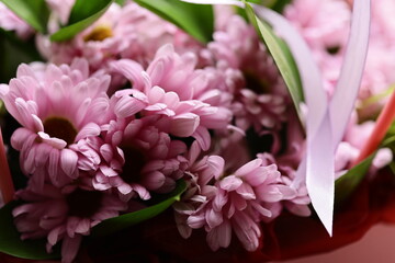 Obraz premium A close up of colorful flowers arranged in a decorative vase, perfect for decorating or as a visual element.