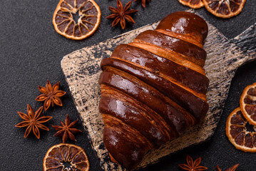 Sweet fresh crispy croissant with chocolate filling