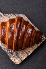 Sweet fresh crispy croissant with chocolate filling